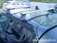 Багажник на крышy Nissan Juke, Атлант, аэродинамические дуги, опора E
