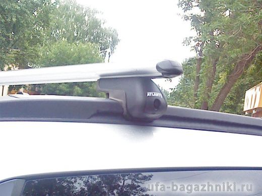Багажник на крышу Opel Astra, аэродинамические дуги на интегрированные рейлинги, Атлант