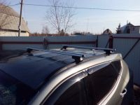 Багажник на крышу Hyundai Santa Fe 2012-..., аэродинамические дуги на интегрированные рейлинги, Атлант