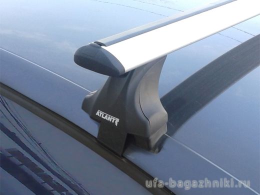 Багажник на крышу Volkswagen Polo sedan 2010-..., Атлант: крыловидные дуги и опоры типа Е