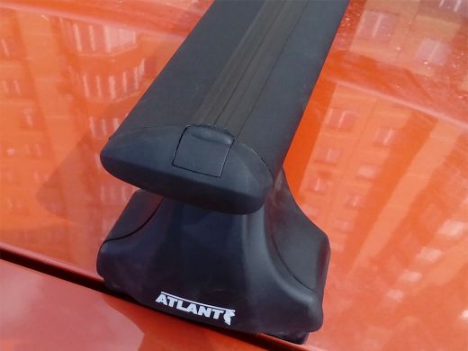 Багажник на крышу Renault Logan, Атлант, крыловидные дуги (черный цвет), опора Е