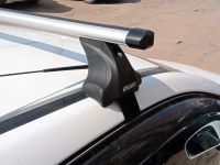 Багажник на крышу Nissan AD (Y12, 2005-...), Атлант, аэродинамические дуги Эконом, опора Е
